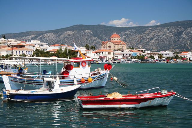Kilada - Traditional boats with church of Aghios Panteleimon